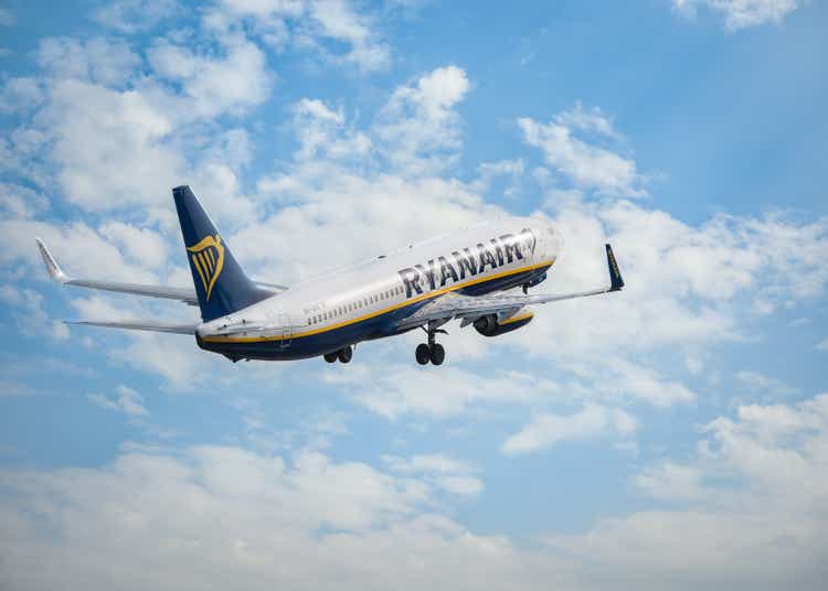 Bucharest, Romania - August 2022: Ryanair Boeing 737 flying against blue sky. Airplane takes off from Henry Coanda International Airport.