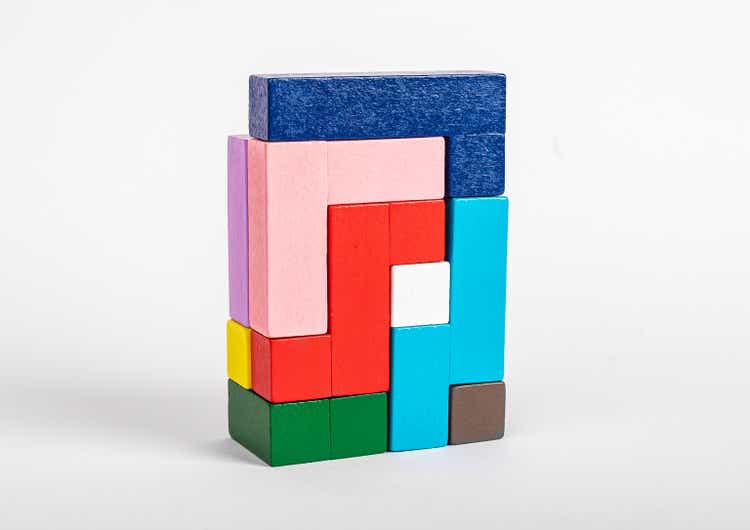 Colorful blocks toy in order. Montessori game with different geometric shapes