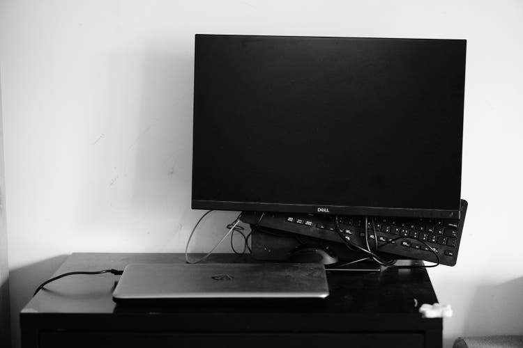 HP laptop and Dell computer screen on the table