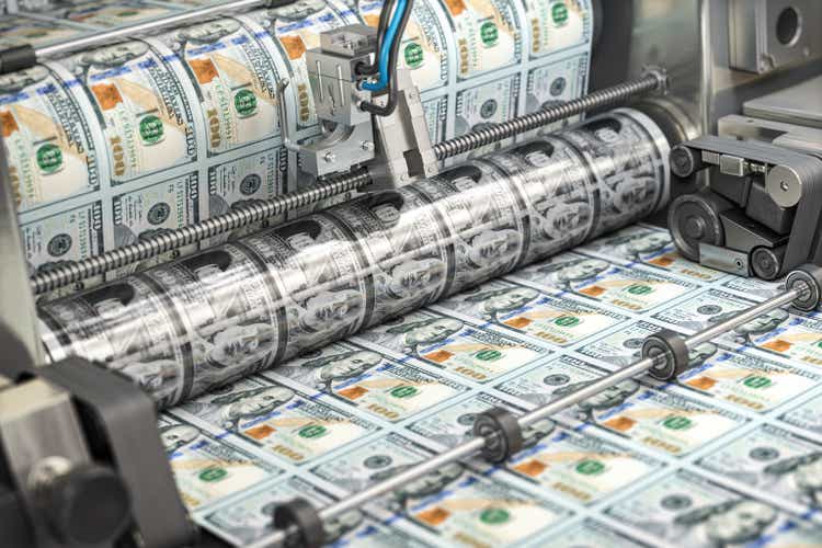 Printing money dollar bills on a print machine in typography.. Finance, tax, stock market and investment, making money concept.