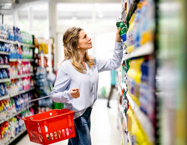 Woman customer buying groceries in supermarket