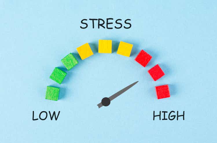 Stress loading bar, burnout syndrome and exhaustion, work life balance, low energy, high pressure, arrow point to critical scale