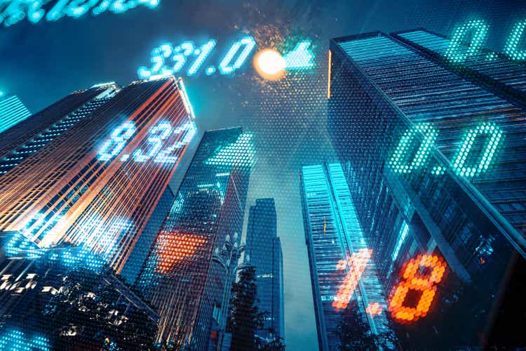 Stock market and investment theme background with city skyscrapers