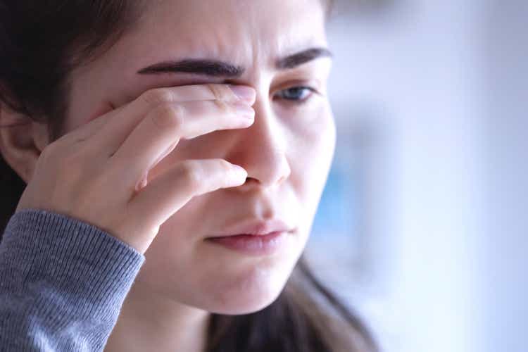 young woman with sore eyes