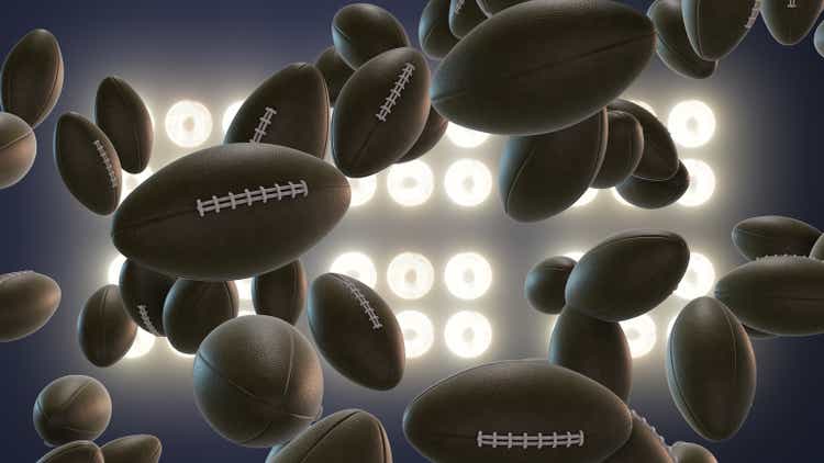 Super Bowl football explosion concept on spotlight background