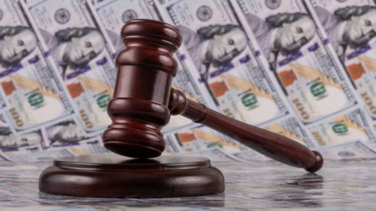 Judge"s gavel against the background of 100 US dollar bills