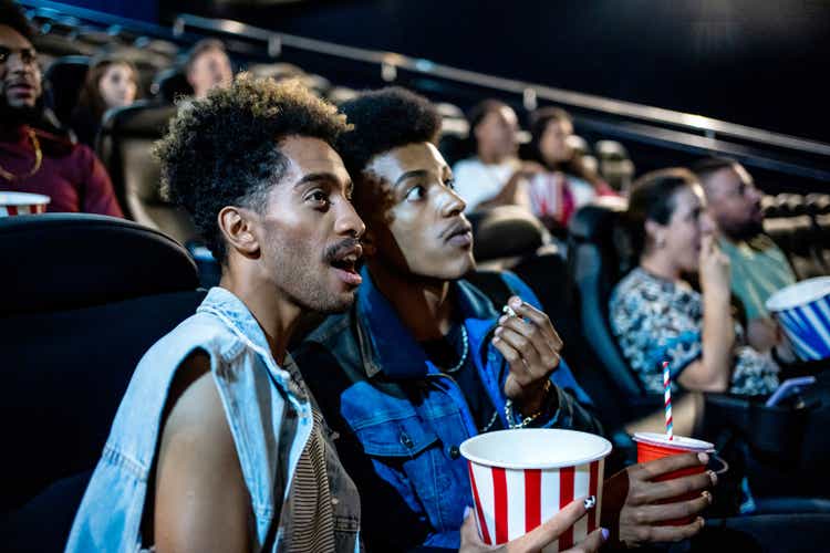 Frightened gay couple watching the movie