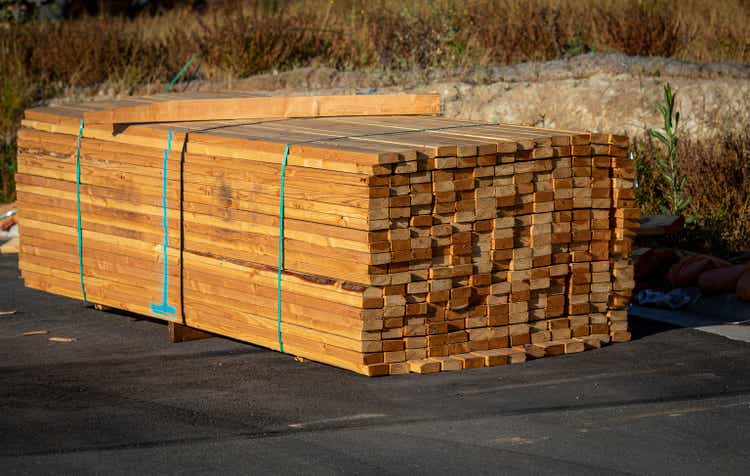 Lumber stacked at a housing construction site