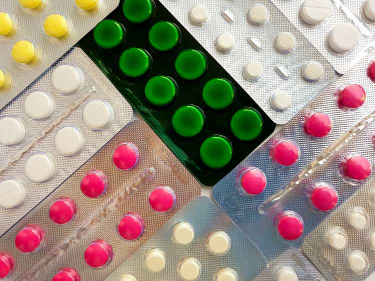 Pharmaceuticals. Antibiotics, various pills, syringes, ampoules on a white background.