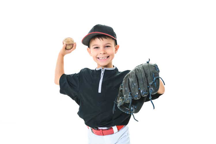 child baseball player Studio shot over white.