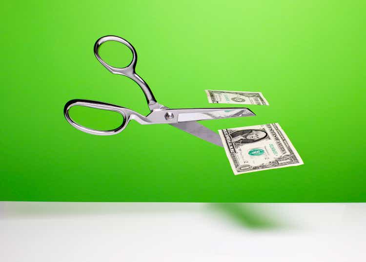 Cutting the budget - Scissors and cut dollar