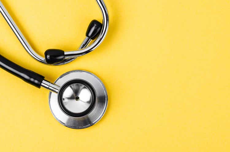 Close up Stethoscope on yellow background with empty space for your text.