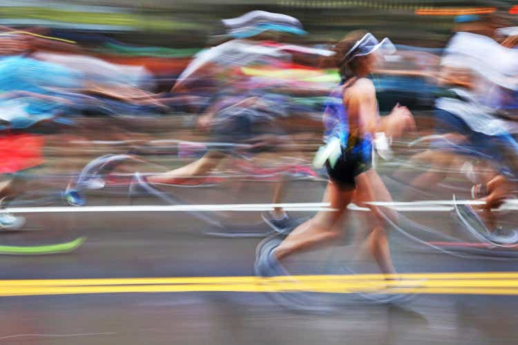 Blurred Action Of Marathon Runners On City Street