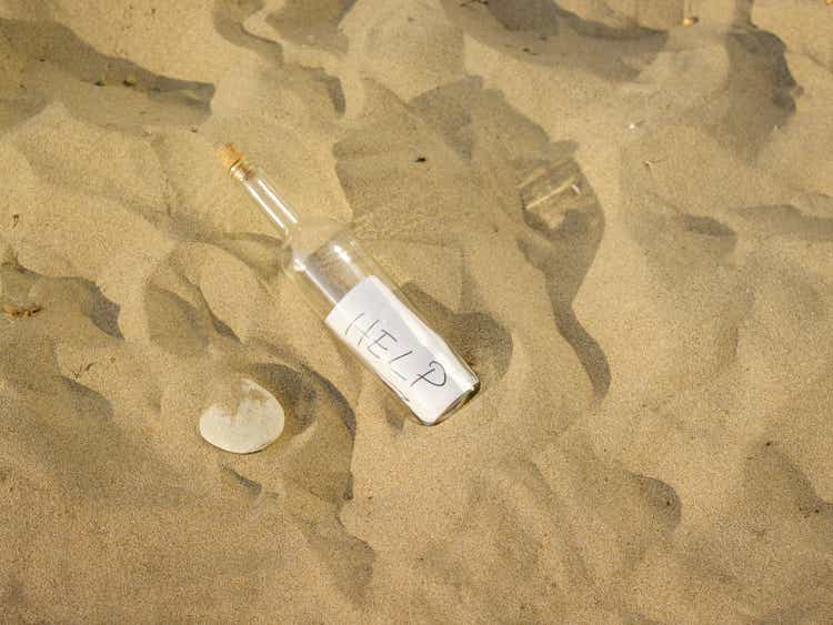 Help note in a bottle at the beach