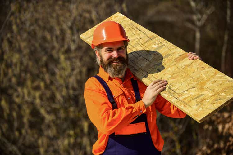 Engineered wood product. Fiberboard used in residential and commercial construction. Set up scaffolding. Assemble temporary equipment or structures. Renovation services. Man carry fiberboard