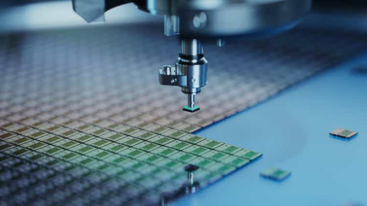 Close-up of Semiconductor Packaging Process. Computer Chips are being Extracted by a Pick and Place Machine from Wafer and Attached to Substrate. Computer Chip Manufacturing at Factory