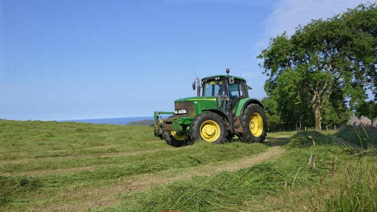 John Deere 6920 Tractor and Mower cutting Grass for Silage on a Farm UK