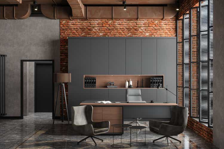 Empty CEO office interior with table, office chair, cabinets and brick wall