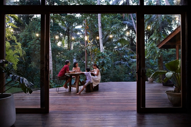 Family enjoying vacation on resort porch