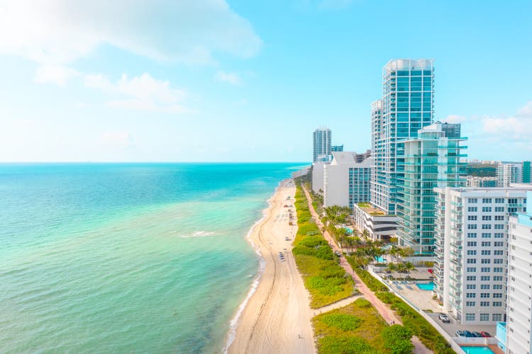 Amazing turquoise ocean water on a white sand beach in Miami Beach Florida USA