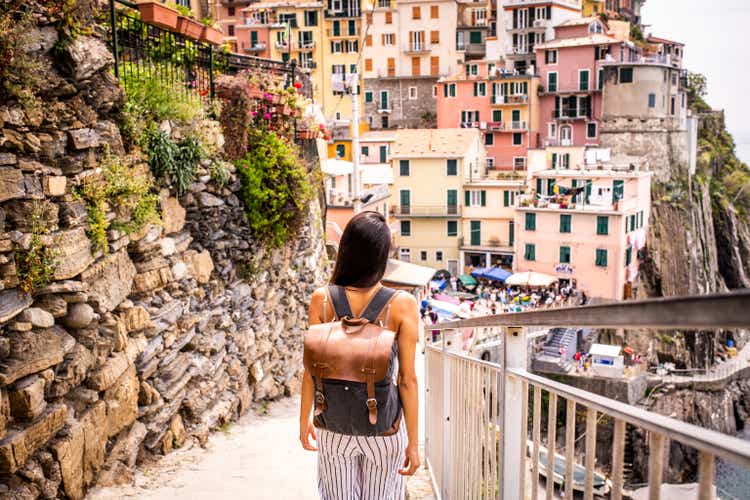 Latin woman visiting beautiful town in Cinque Terre coast, Italy
