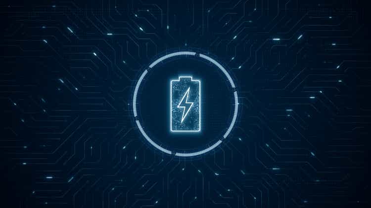 Blue digital battery logo and futuristic technotogy circle HUD with circuit board and data transfer on abstract background