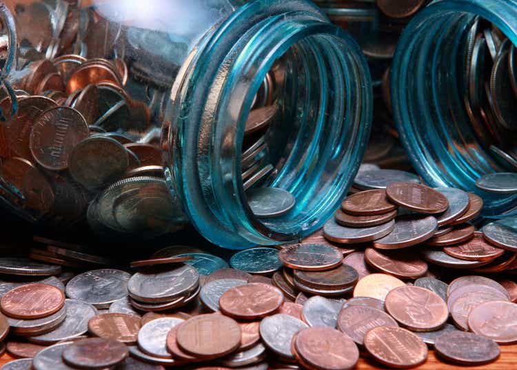Coins in a blue canning jar
