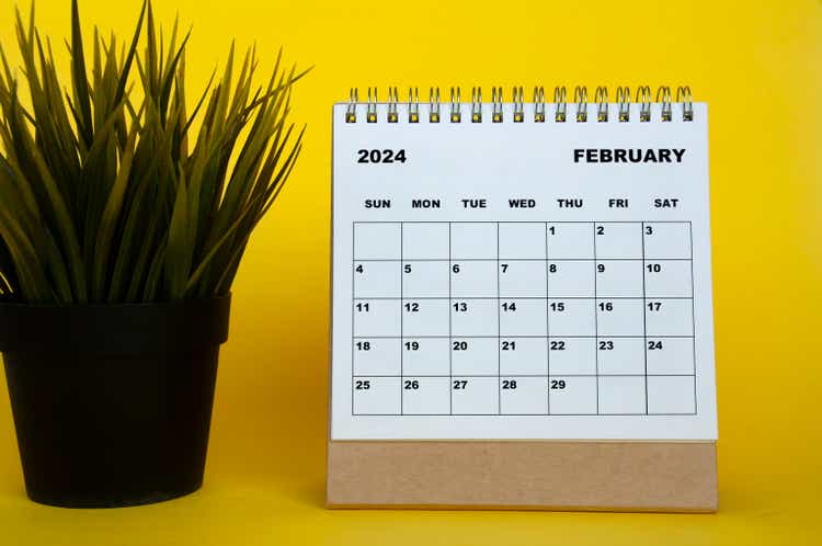 February 2024 month calendar with table plants on yellow cover background.  Monthly calendar concept.