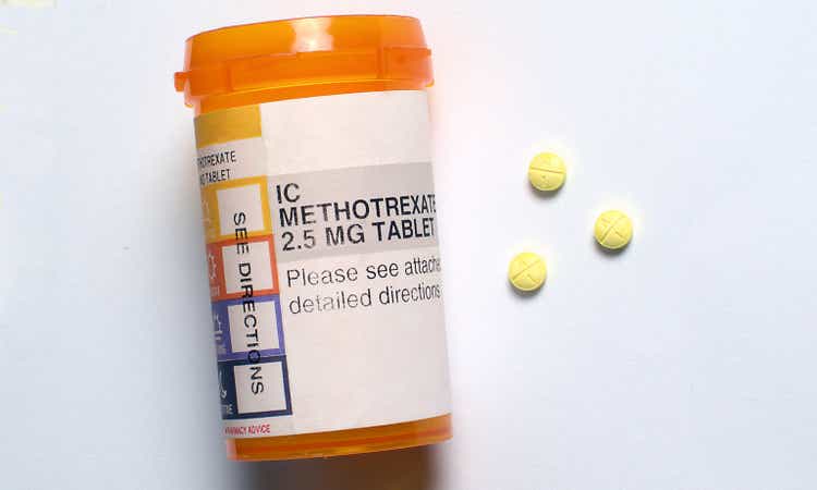 Generic Methotrexate pills alongside a prescription medication container.