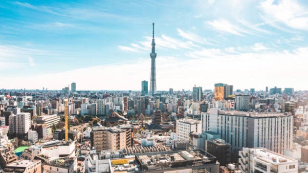 Tokyo Skytree overlooking rooftops of homes cityscape in Japan