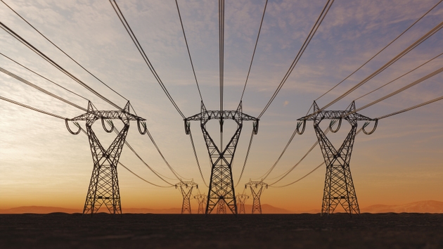 High Voltage Electric Power Lines At Sunset