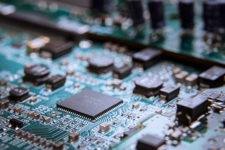 Abstract close-up on theMicrochip on blue circuit board