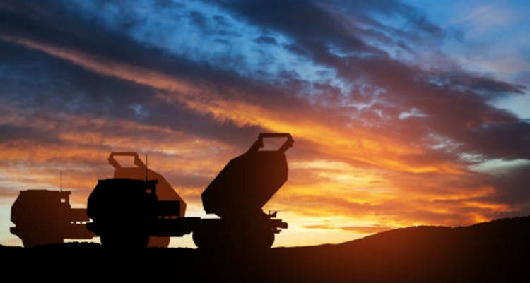Artillery rocket system are aimed to the sky at sunset. Multiple launch rocket system.