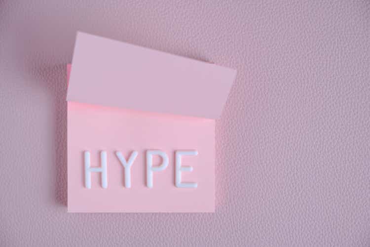 Word hype laid out white letters pink piece paper.Concept hype, popularity and fun.