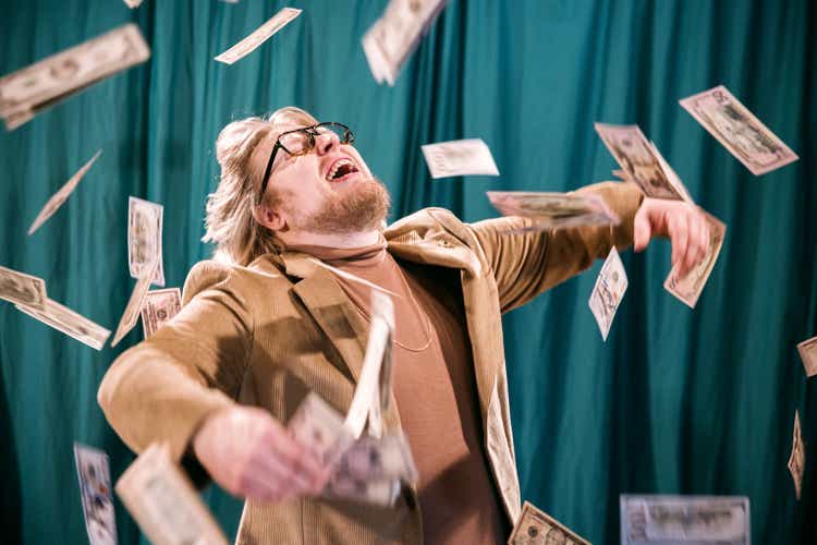 Retro Styled Man Celebrates in Falling Money