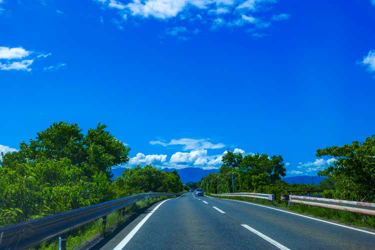 blue sky and undulating road