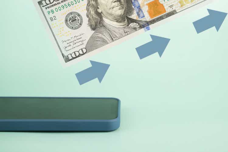 international money transfer, online banking, application for send and receive money, phone and cash on a blue background