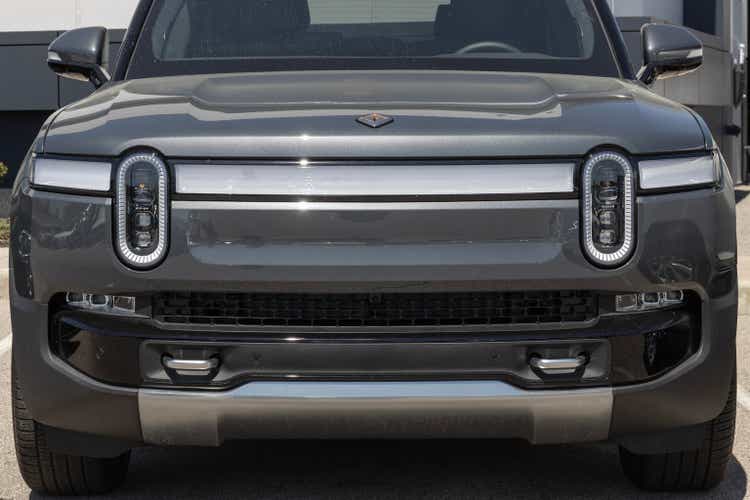 Rivian R1T Pickup Truck display at a dealership. Rivian offers the R1T in Explore, Adventure and Launch models.