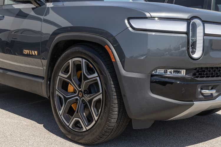 Rivian R1T Pickup Truck display at a dealership. Rivian offers the R1T in Explore, Adventure and Launch models.