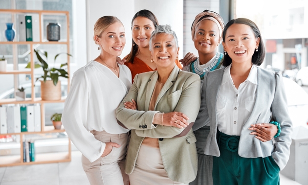 Diversity, portrait and business women with support, teamwork and group empowerment in office leadership. Career love and hug of asian, black woman and senior people or employees smile for solidarity