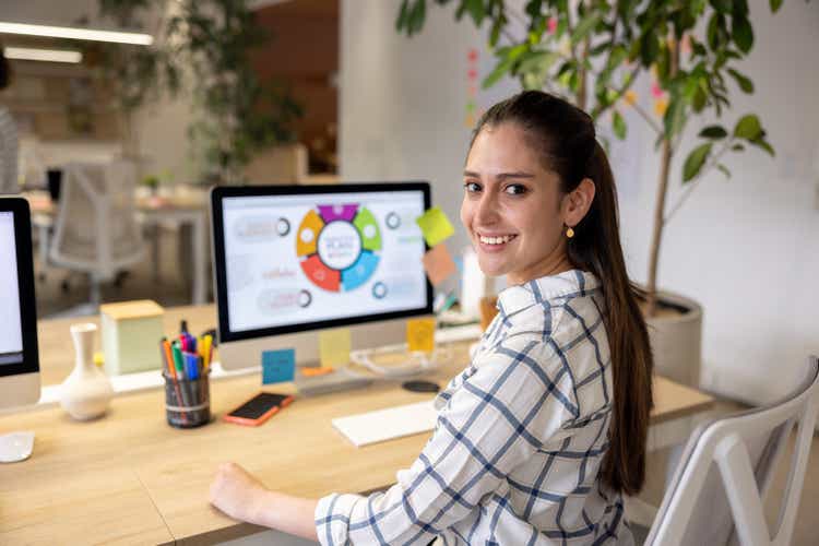 Happy business woman working at a coworking office