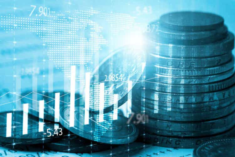 Coin stacking with stock market chart graph for currency exchange of global trade forex and stock market investment concept.