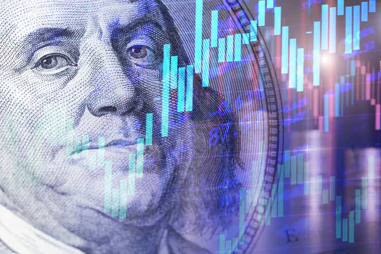 Portrait of Franklin from a hundred dollar bill with Candlestick charts as a concept of Stock trading or Stock background