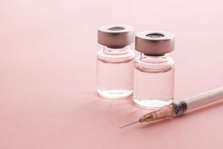 Beauty injections for cosmetic surgery and anti-aging. pink background.