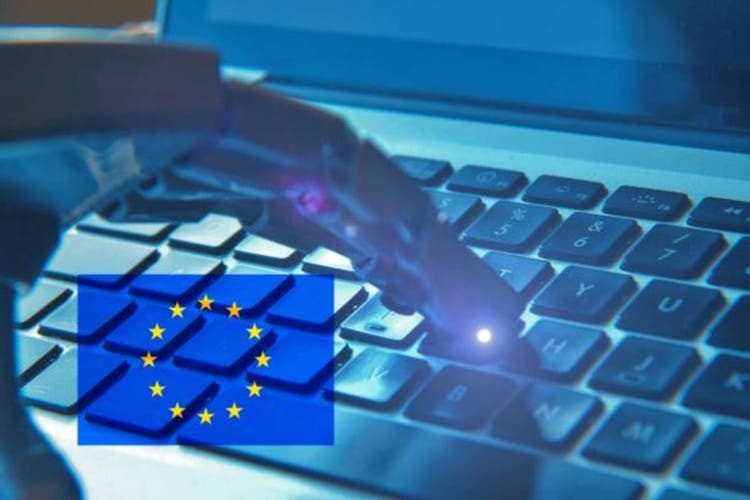 Robotic hand typing on a keyboard with the European flag . Concept of investments on artificial intelligence from European countries .