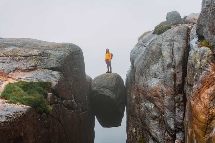 Woman standing on Kjeragbolten