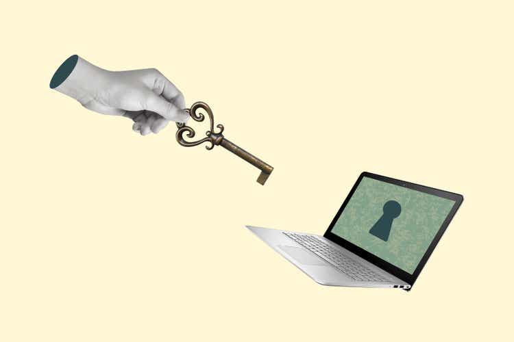 Creative collage of hand with a key and laptop.