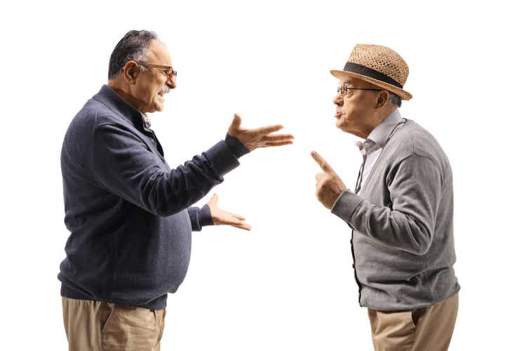 Profile shot two mature men having an argument