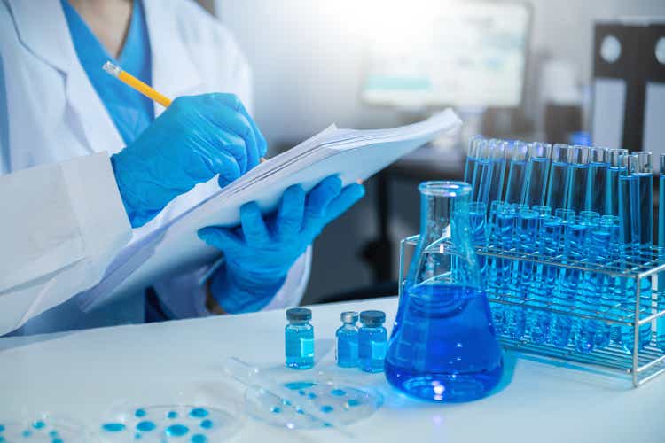 Female scientist researcher conducting an experiment working in the chemical laboratory