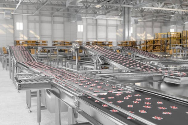 Close-up View Of Capsule Pills In Blister Pack On Conveyor Belt In Pharmaceutical Factory